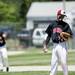 Milan junior pitcher Kyle Schrader looks down after allowing a run during the game against Richmond on Friday, June 14. Daniel Brenner I AnnArbor.com